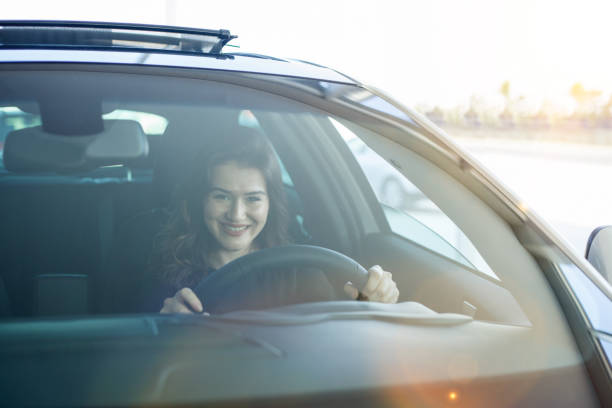 istock businesswoman driving car 1174172847