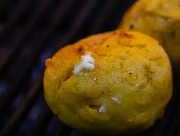 Photo of Close up of romanian traditional grilled polenta with cheese, named 