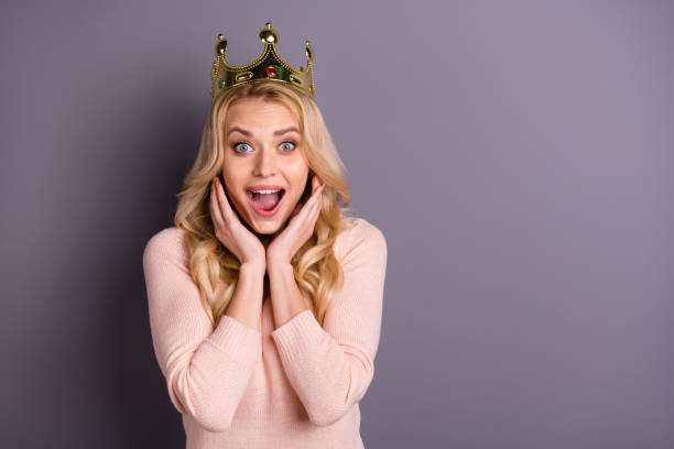 I wish world piece. Photo of funny lady with golden crown on head overjoyed by nomination wear casual trendy pullover isolated grey color background I wish world piece. Photo of funny lady with golden crown on head overjoyed by nomination, wear casual trendy pullover isolated grey color background princess crown tiara prom stock pictures, royalty-free photos & images