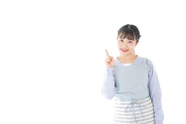 istock Young housewife Pointing with smile 1174179635