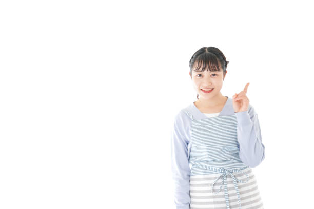 istock Young housewife Pointing with smile 1174179821
