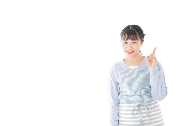 istock Young housewife Pointing with smile 1174179828