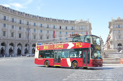 Rome Italy - June 13, 2019: People take Bigbus tourist hop on hop off bus in Rome Italy