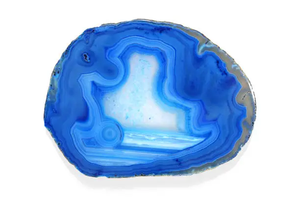 Photo of Slice of isolated blue agate geode on white background