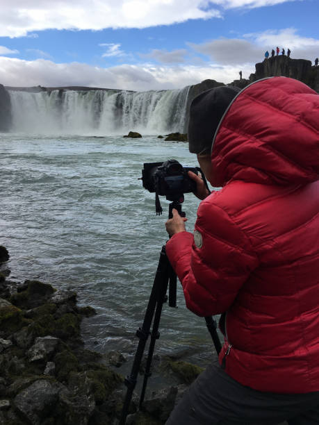 istock Photographer at Godafoss Falls, Iceland 1174185597