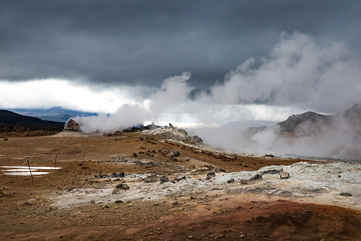 steam and gases rising from volcanic landscape