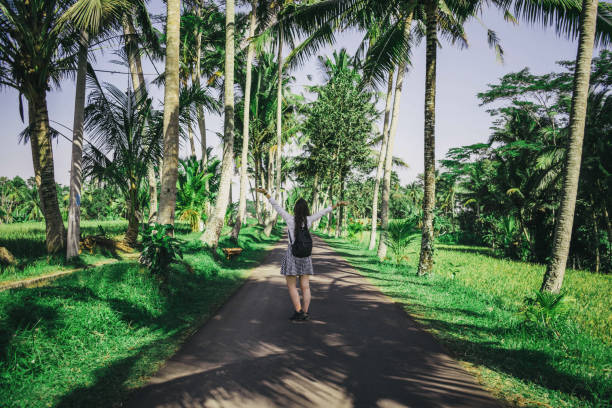 istock Young woman in tropical environment 1174205210