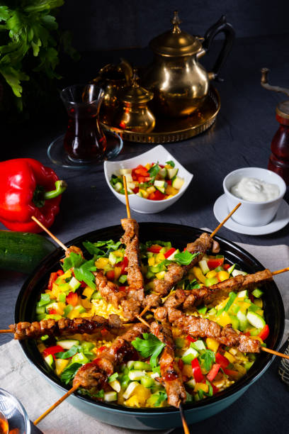 istock Lamb skewers with curry rice and different vegetables 1174207718