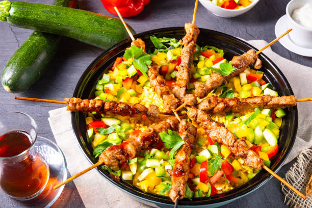 istock Lamb skewers with curry rice and different vegetables 1174208673