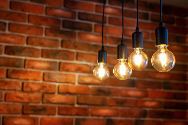istock old brick wall and four old lamps close-up, background 1174211223