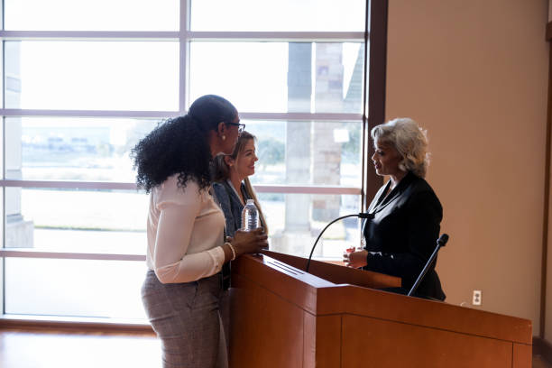 istock Women talk with female political candidate 1174211794