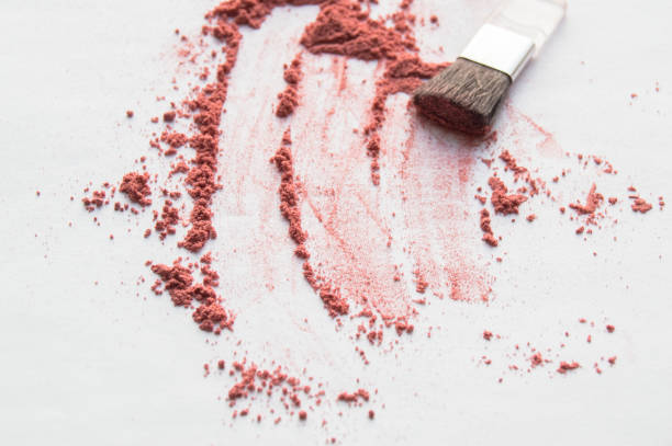 istock Diffuse blush or beige brown colored loose face powder and makeup brush isolated on white background. Top view 1174214747