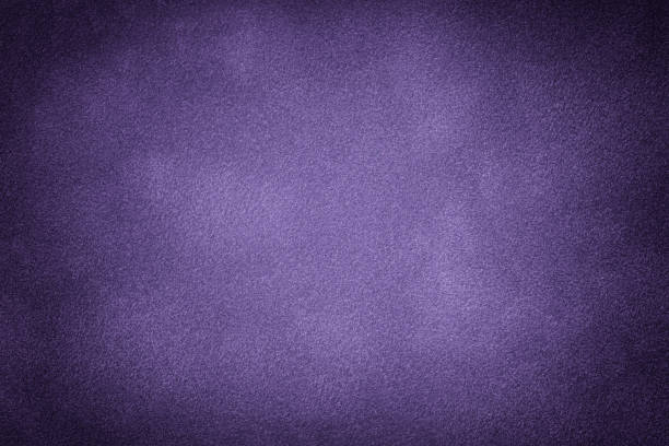 istock Dark violet matte background of suede fabric, closeup. 1174216639