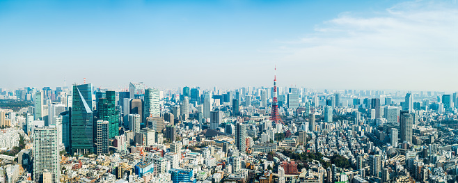 The iconic spire of the Tokyo Tower overlooking the skyscrapers and crowded cityscape of central Tokyo, Japan’s vibrant capital city.