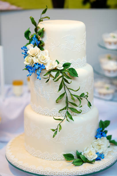 istock White wedding cake decorated with sugar flowers 1174218002