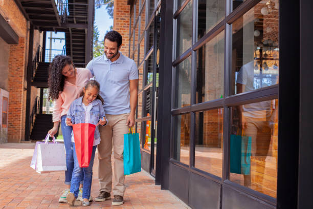 istock Family shopping in mall 1174230178