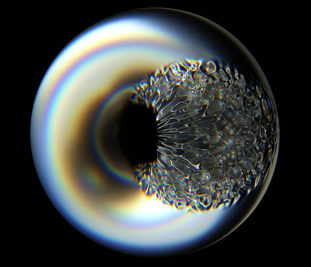 istock 3d render of abstract glass sphere with deformed metal torus inside with dispersion effect on black background 1174232377