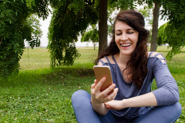 istock Young Woman using smart phone 1174236920