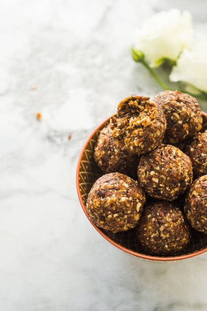 istock Energy balls with healthy ingredients on marble 1174237998