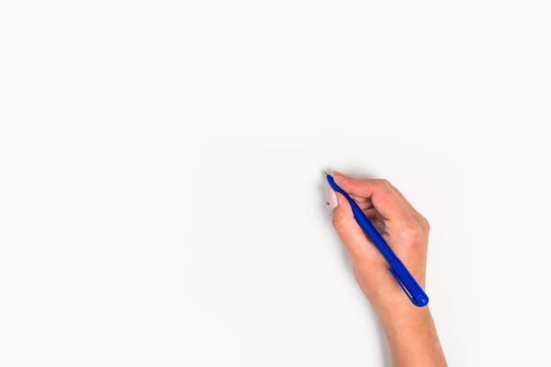 istock Female hands hold a pen. Isolated on white background. copy space, template. 1174238293