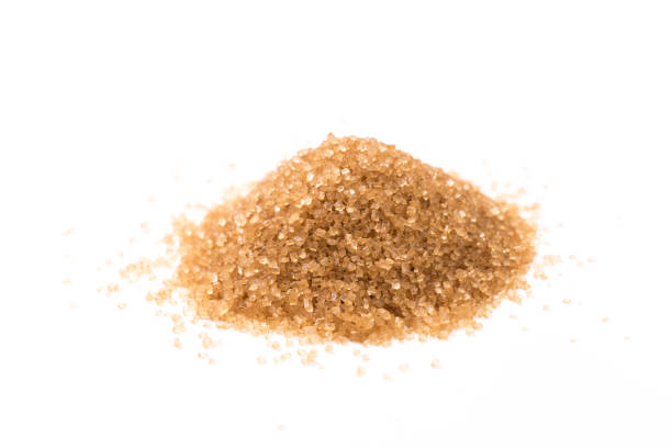 istock brown sugar isolated on white background. Top view. Flat lay 1174238430