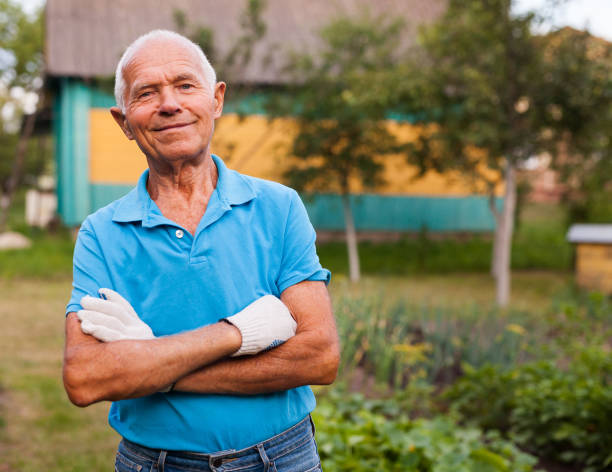 istock Elderly gardener posing in his garden 1174238851