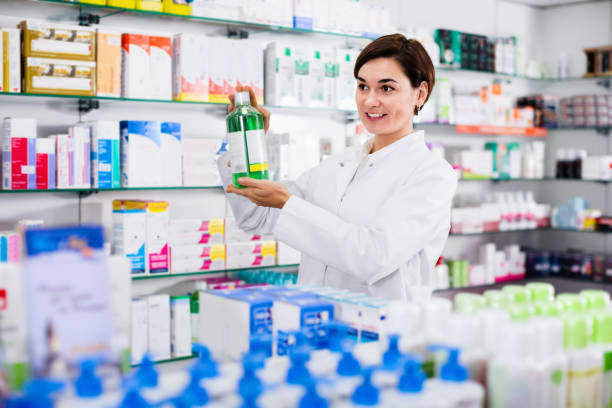 istock Female pharmacist suggesting useful body care products 1174239012