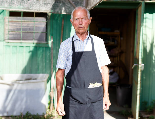 istock Serious gardener near garden shed 1174240750