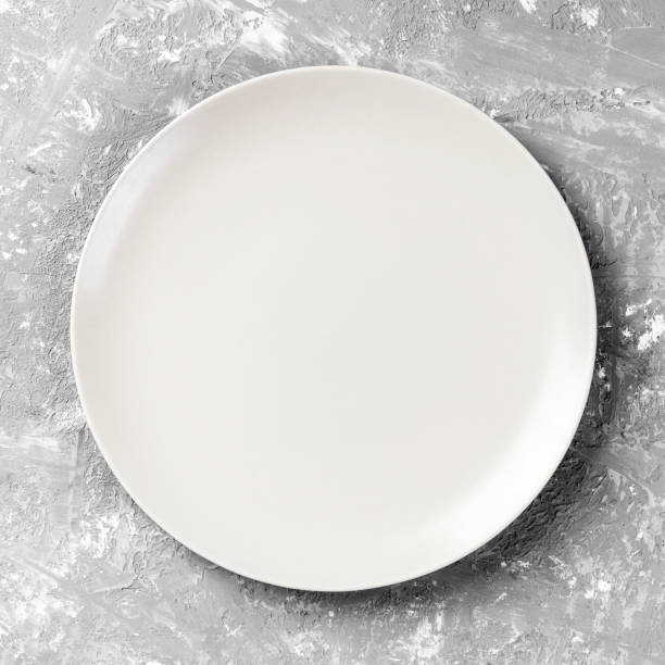 istock Top view with empty for you design. Empty white plate on wooden background 1174241037