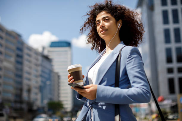 istock Young happy businesswoman communting to work 1174241069