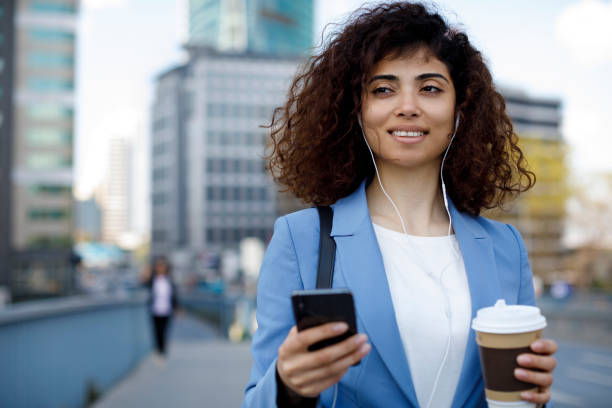 istock Young happy businesswoman communting to work 1174241198