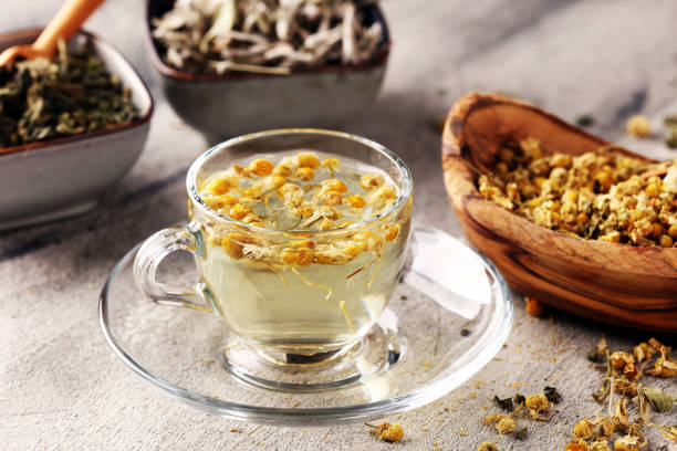 istock tea with Chamomile, sage and stinging nettle tea. Dried chamomile tea on table 1174244354
