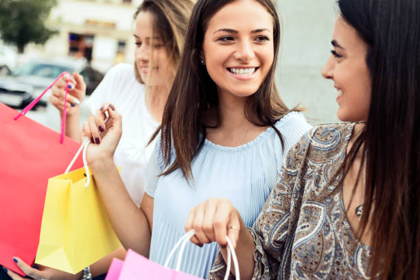 istock Three women shopping together 1174244498