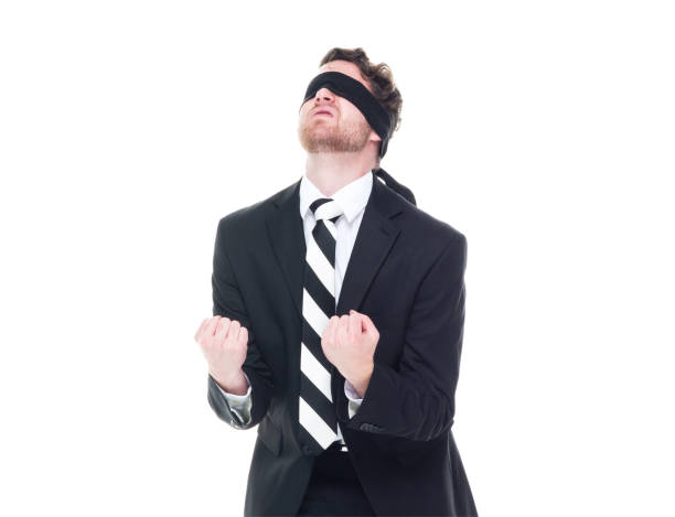 istock Handsome businessman wearing a black suit - is wearing a blindfold 1174250067