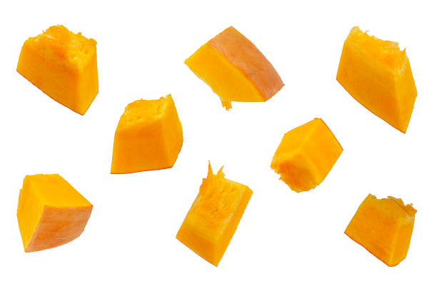 istock Pumpkin slices isolated on a white background, top view. Sliced pumpkin isolated on white. Pieces of pumpkin, top view. Diced pumpkin, closeup. 1174253268