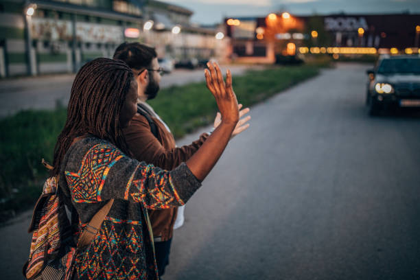 istock People catching taxi 1174254384