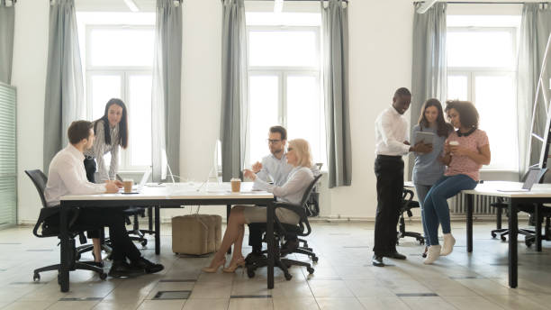 istock Diverse employees busy office routine in coworking space 1174254720