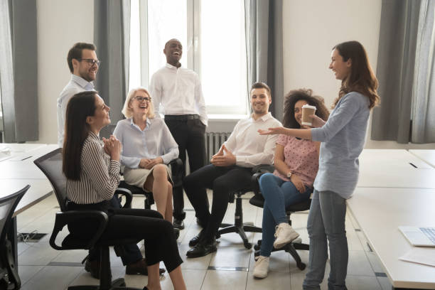 istock Smiling diverse colleagues have fun talking at coffee break 1174254723