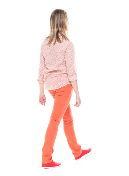 istock Beautiful white female in bright clothes - walking 1174254745