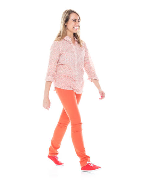 istock Beautiful white female in bright clothes - walking 1174254755