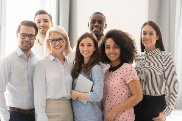 istock Smiling multiethnic employees posing together for group picture 1174254841