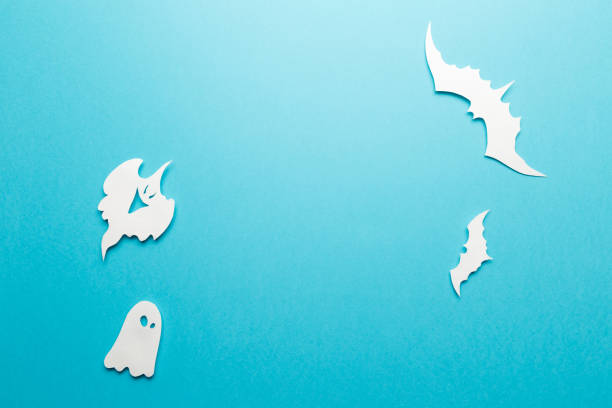istock Halloween decorations. Halloween paper decorations on pastel blue background. Top view. Flat lay of accessory decoration Halloween festival. Copy space. Minimal creative concept. Pastel colors 1174255468