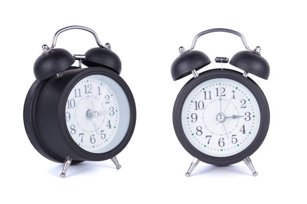 istock Black alarm clock isolated on white background 1174255557