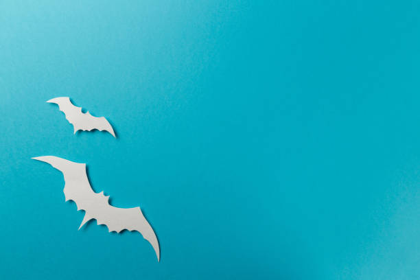 istock Halloween decorations. Halloween paper decorations on pastel blue background. Top view. Flat lay of accessory decoration Halloween festival. Copy space. Minimal creative concept. Pastel colors 1174255572