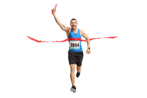 istock Man finishing a relay race with a baton in his hand 1174256878