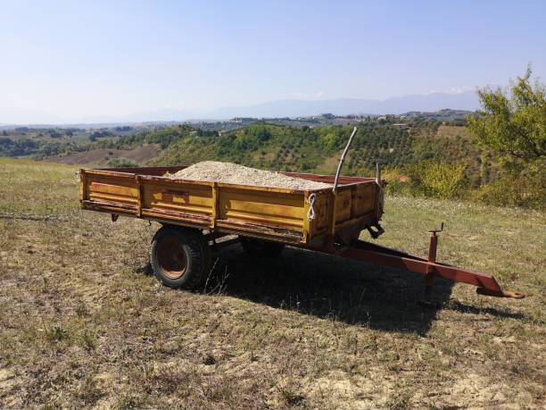 istock old tractor trailer stopped in the countryside 1174259781