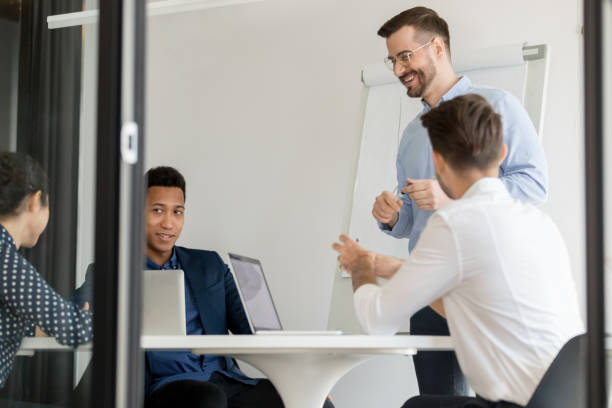 istock People takes part in corporate training lead by experienced coach 1174262714