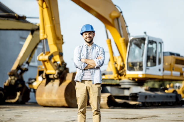 istock Builder at the shop with heavy machinery 1174262715