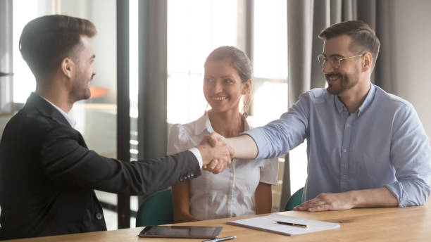 istock Successful businessmen starting negotiations greeting each other shaking hands 1174262854