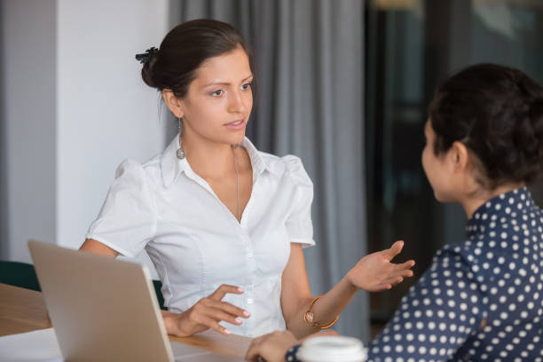 istock Diverse female office workers working on project sitting at workplace 1174263006